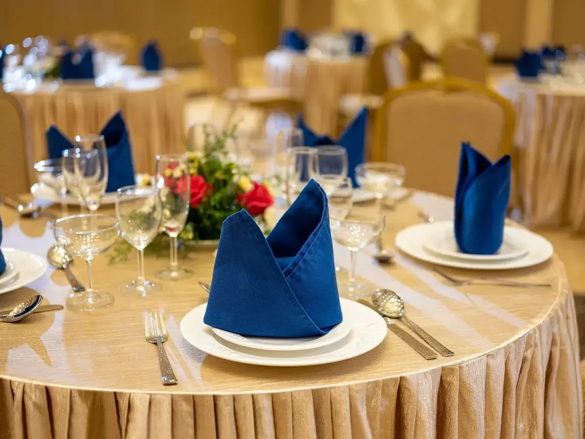 Table laid with detailed place settings, reflecting service tailored to each event