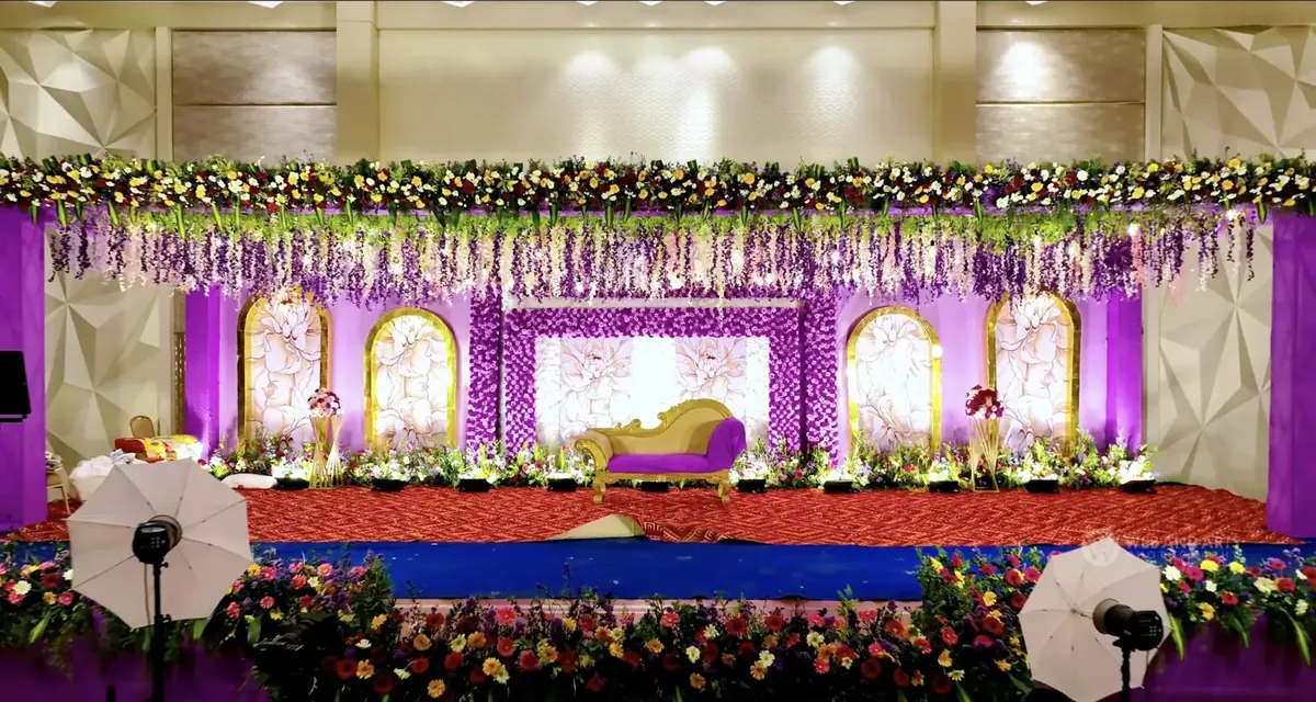 Floral wedding reception stage at Suganya Convention Centre, Pondicherry