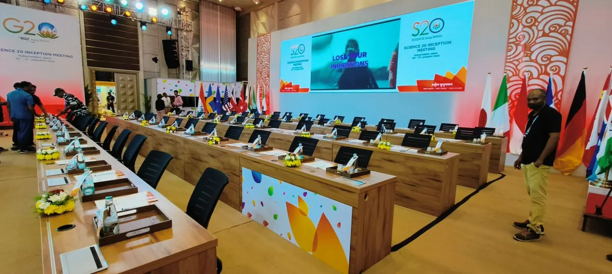 G20 delegate seating with country flags and screens, Suganya Convention Centre, Puducherry