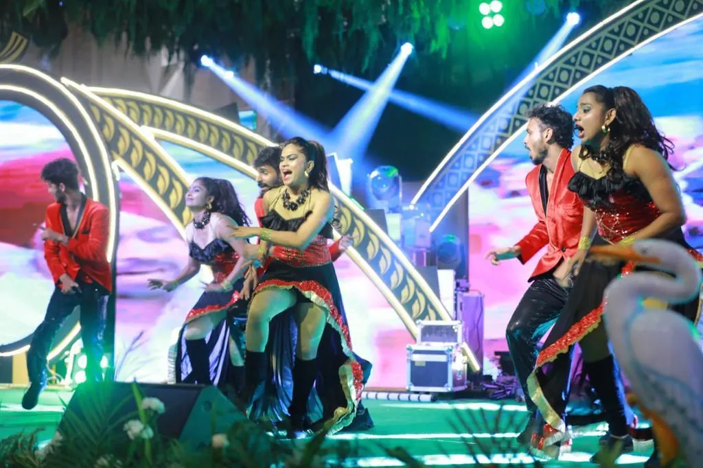 Dance troupe performing on stage at Suganya Convention Centre, Pondicherry