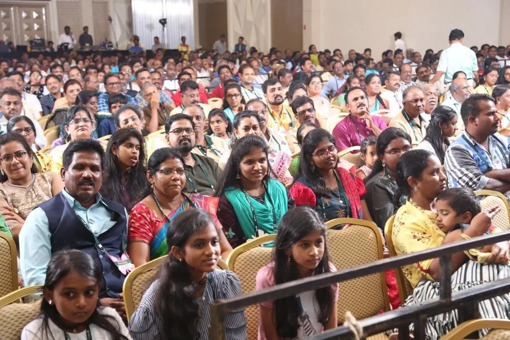 Packed audience seated in the main hall, Suganya Convention Centre, Pondicherry