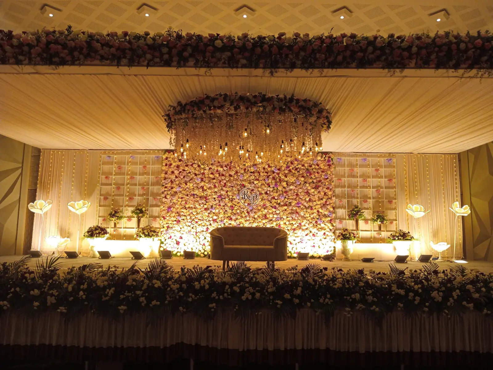 Grand floral wedding reception stage at Suganya Convention Centre, Pondicherry